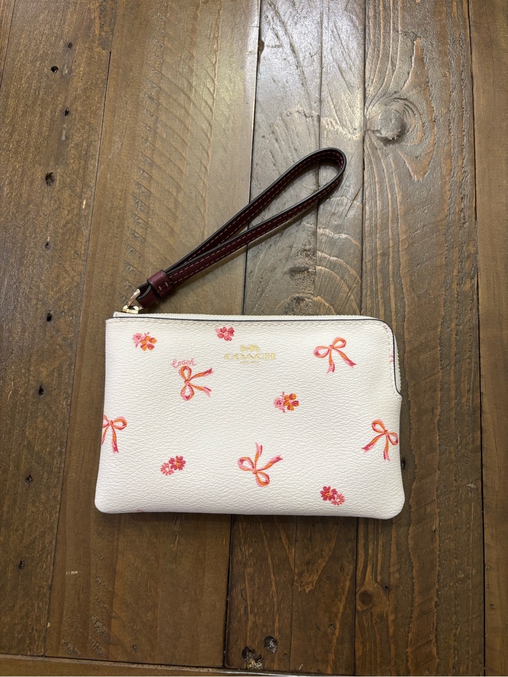 Coach Corner Zip Wristlet in Bow Print